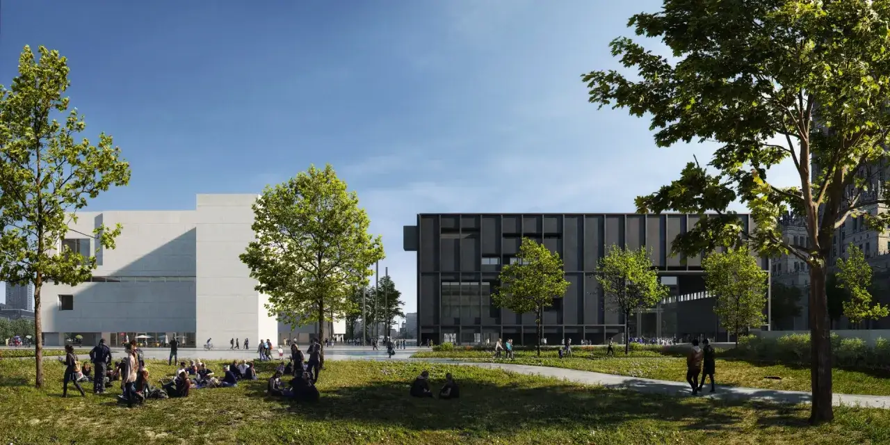 Nowoczesne muzeum sztuki nad Wisłą, z betonową i grafitową fasadą, otoczone zielenią i spacerującymi ludźmi.