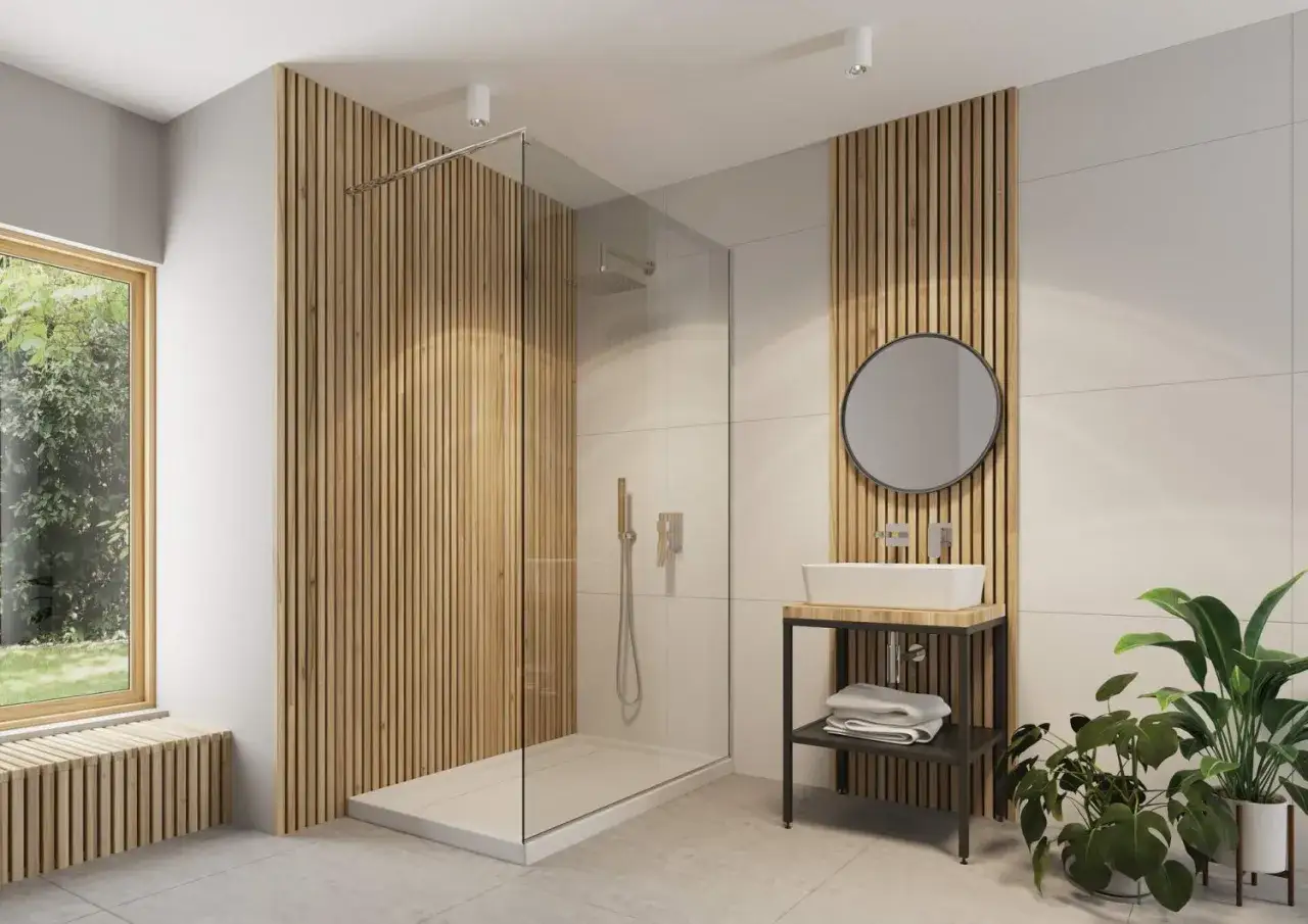 Nowoczesna łazienka z prysznicem walk-in i umywalką. Ciepło drewna podkreślają pionowe lamele na ścianach.