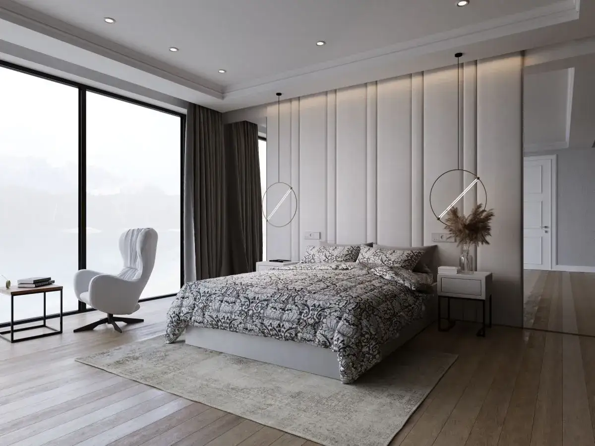 Nowoczesna sypialnia z tapicerowanym zagł&oacute;wkiem. Czy panele tapicerowane można przykleić na tapetę? Duże okno z widokiem na g&oacute;ry.