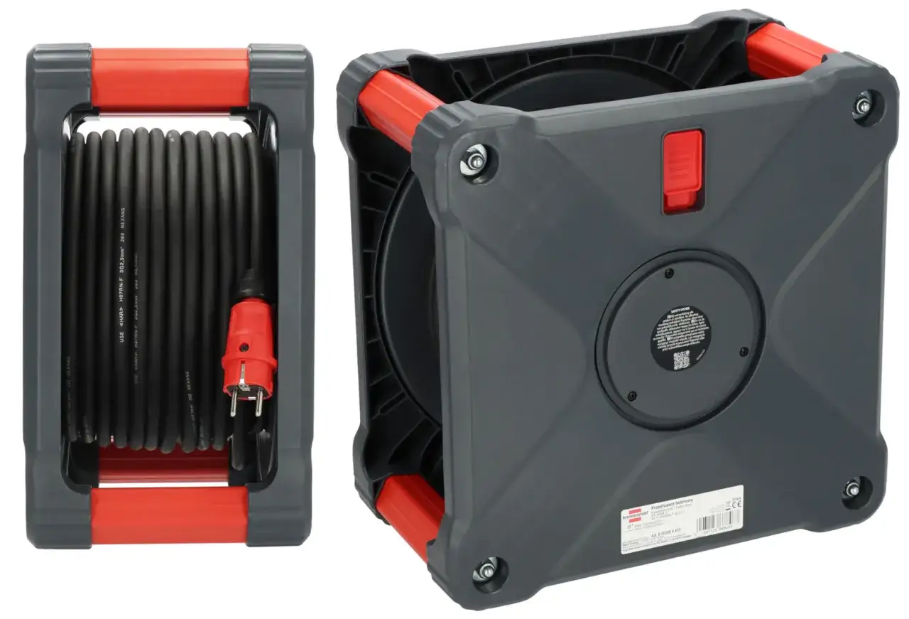 Szary bęben na przedłużacz z czerwonymi elementami, gotowy do zwinięcia kabla.