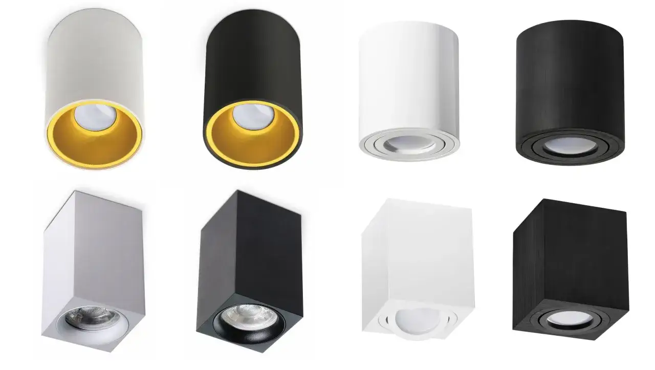 Nowoczesne lampy ledowe na sufit: cylindryczne i kwadratowe, w kolorach białym, czarnym i srebrnym, niektóre z ozdobnym złotym wnętrzem.