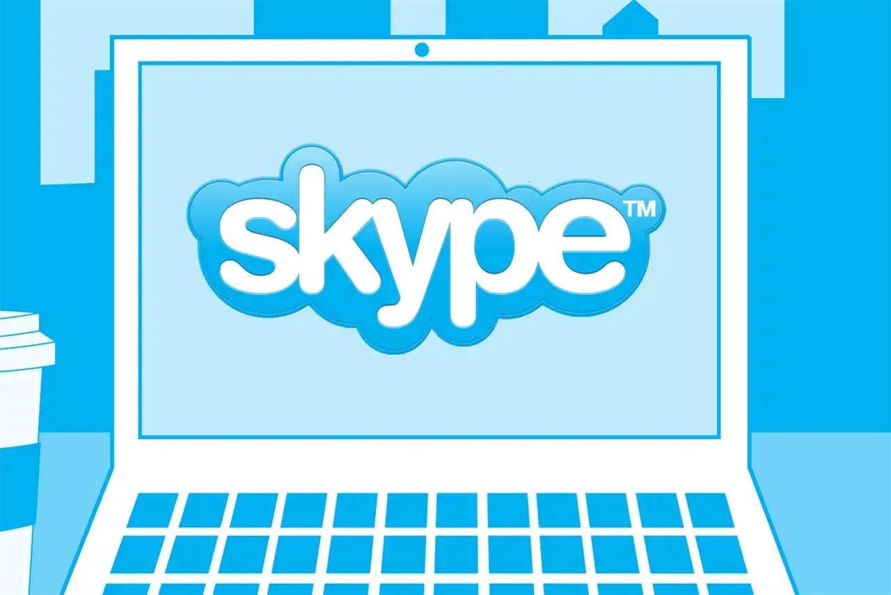 Ilustracja przedstawia laptop z logo Skype na ekranie, idealna do poradnika jak zainstalować Skype na komputerze.