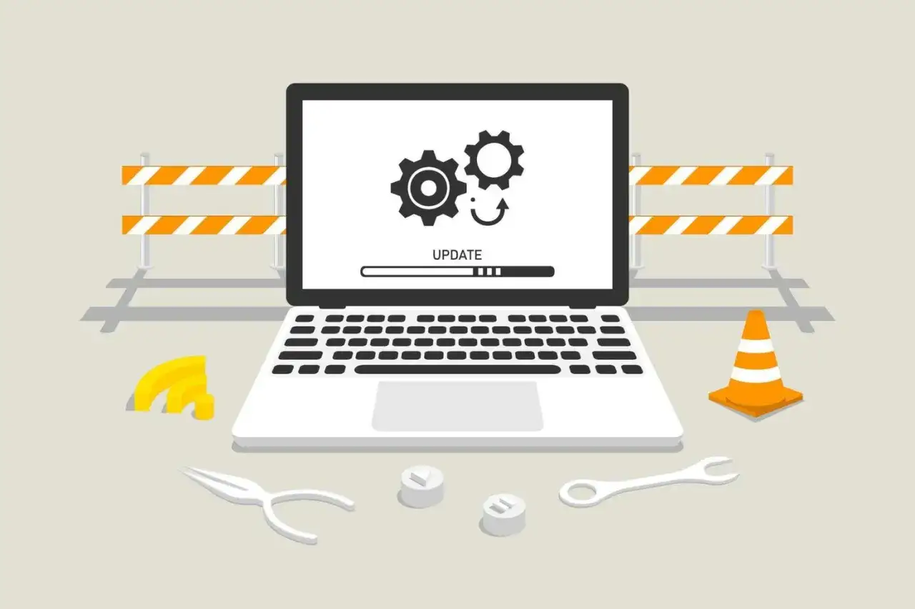 Laptop z ikoną aktualizacji i paskiem postępu. Obok narzędzia i znaki ostrzegawcze. Dowiedz się, jak zaktualizować Windows 10.