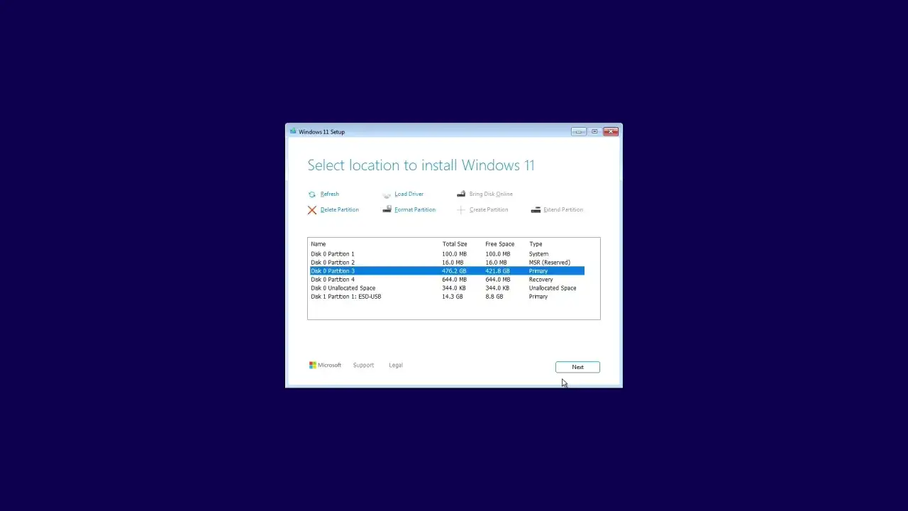 Ekran wyboru lokalizacji do instalacji Windows 11. Widoczne partycje dysku, gotowe do wyboru miejsca na instalację systemu.
