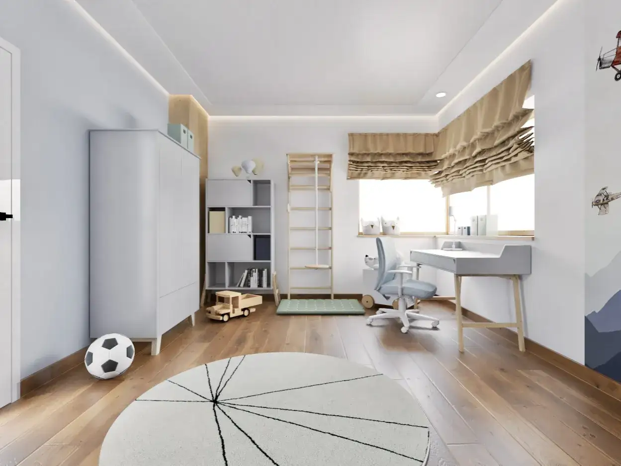 Pokój nastolatka inspiracje: jasne wnętrze z biurkiem, regałem, szafą i drabinką gimnastyczną. Na podłodze piłka i okrągły dywan.