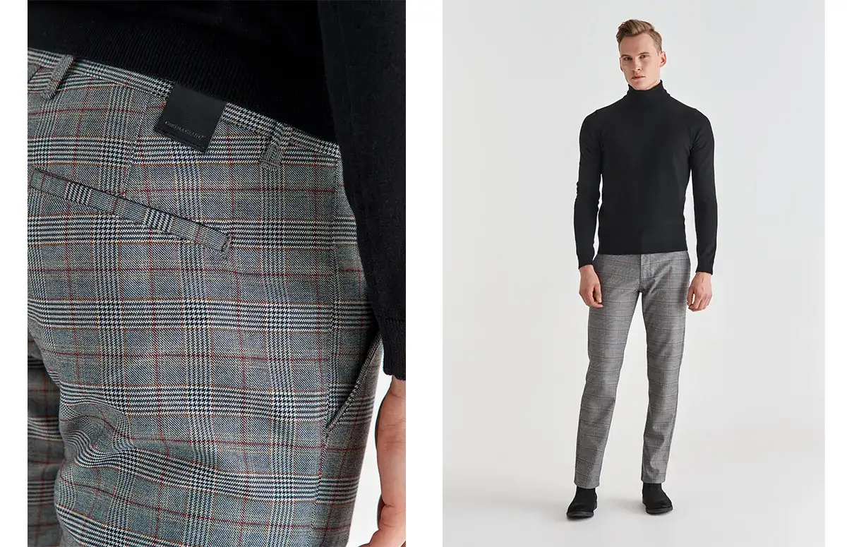 mężczyzna w spodniach w kratę i gładkim golfie casual