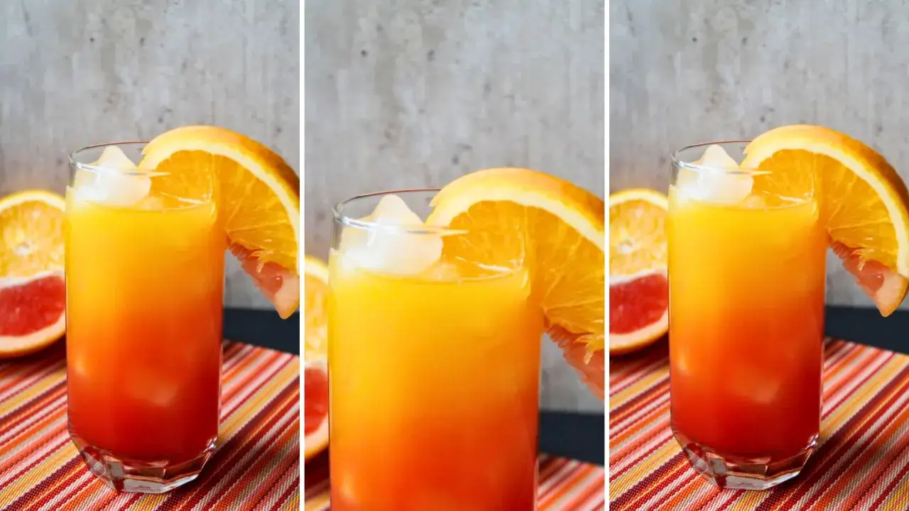 Kolorowy drink z pomarańczą i lodem, idealny, by dowiedzieć się, jak zrobić drinka z malibu.