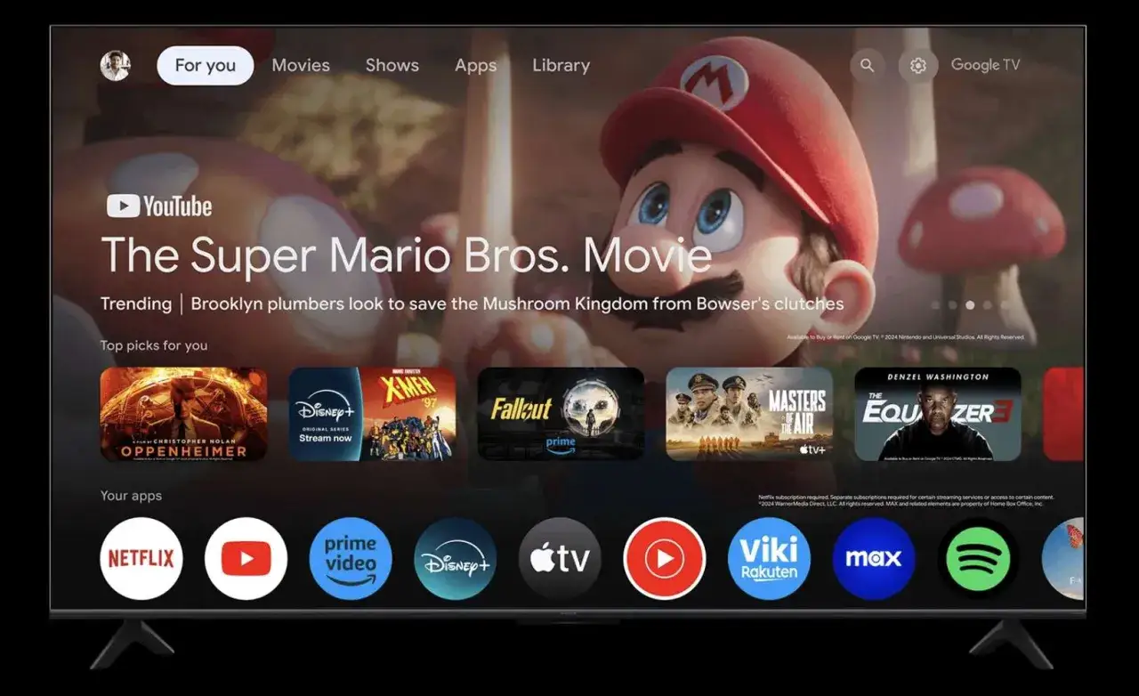 Aplikacja Google TV: ekran gł&oacute;wny z Mario, filmami i Twoimi ulubionymi aplikacjami jak Netflix, YouTube, Disney+.