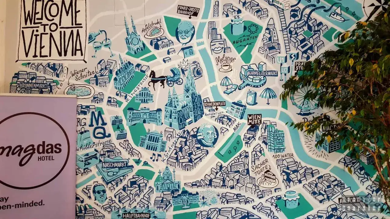 Mapa Wiednia z widokiem na metro, zabytki i lokalne przysmaki, jak Wiener Schnitzel i Sacher Torte.