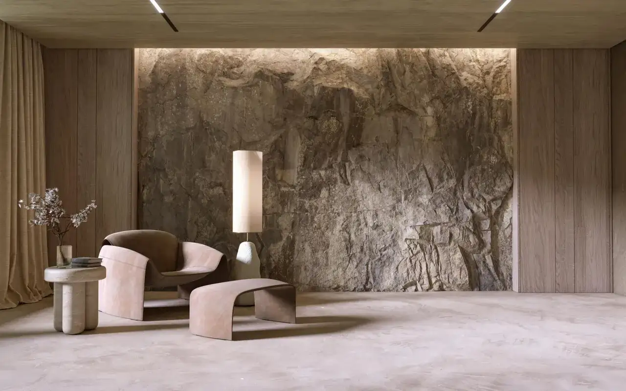 Surowa, naturalna ściana z kamienia tworzy tło dla nowoczesnych mebli.