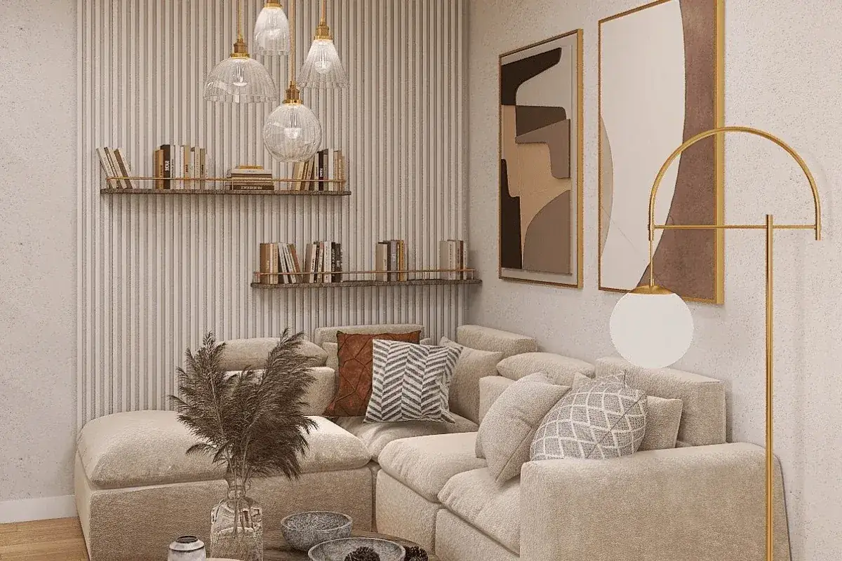 Przytulne wnętrza domu: beżowa kanapa, półki z książkami, nowoczesne lampy i abstrakcyjne obrazy tworzą stylową przestrzeń.