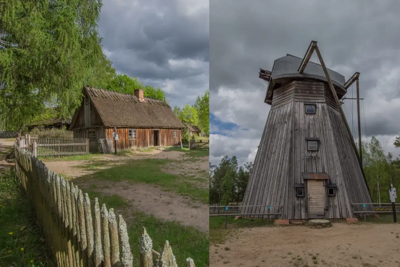 Drewniana chata i wiatrak w muzeum polskiej sztuki ludowej.