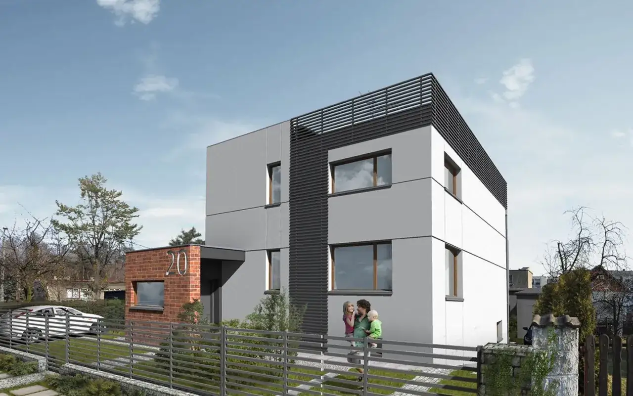 Nowoczesny dom kostka z szarą elewacją, ceglanym detalem i nowoczesnym ogrodzeniem. Rodzina spaceruje przed posesją.
