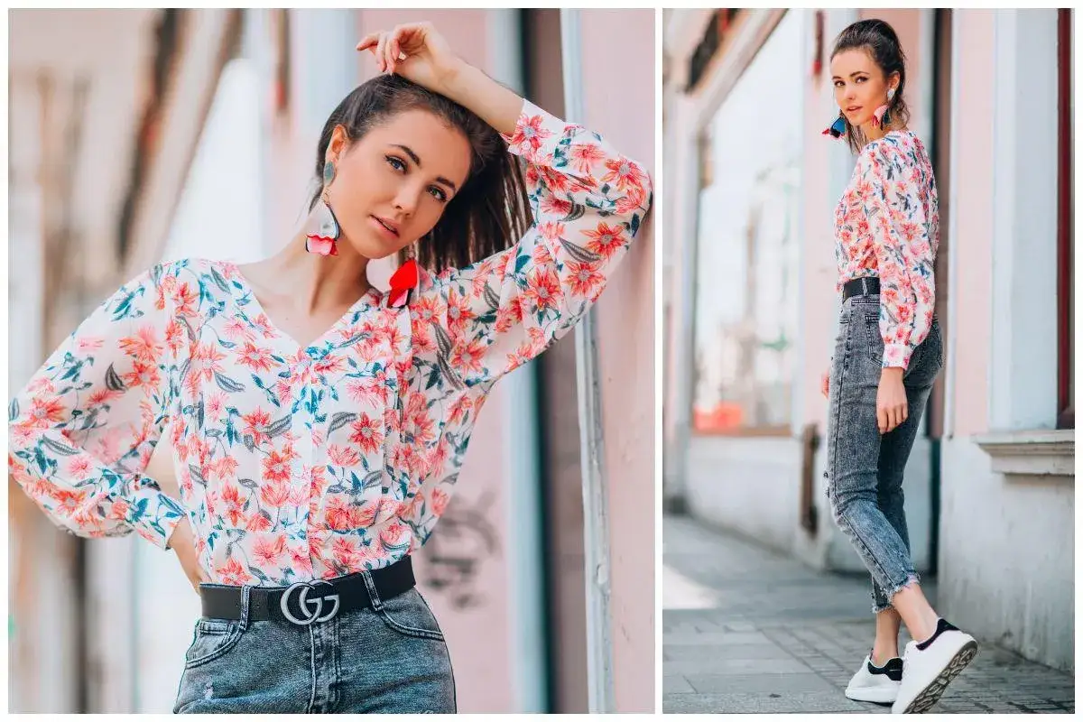 Kobieca stylizacja: jak nosić bluzki w kwiaty. Modelka w kwiecistej bluzce i jeansach prezentuje letni look.