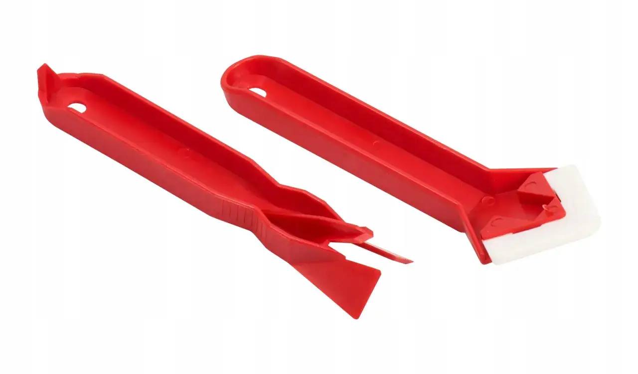 Dwa czerwone narzędzia do wygładzania silikonu. Pozwalają na precyzyjne nałożenie materiału, nawet jeśli czy silikon można nakładać warstwami.