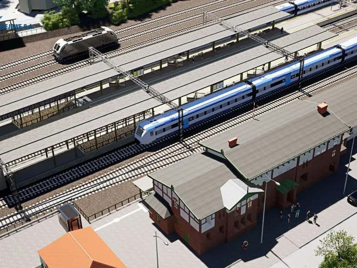 Nowoczesna stacja kolejowa, gdzie nowoczesne pociągi, w tym Pendolino do Szczecina, czekają na pasażerów.
