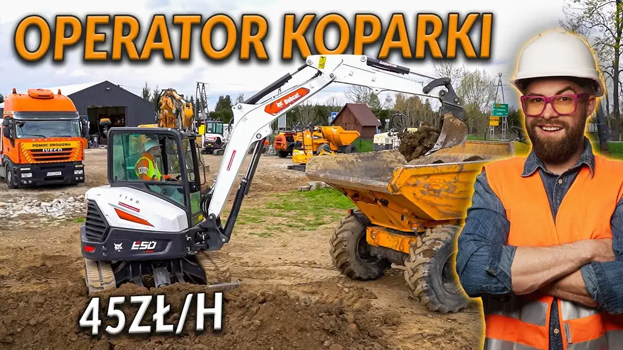 Operator koparki pracujący na budowie z widocznym laptopem lub tabletem