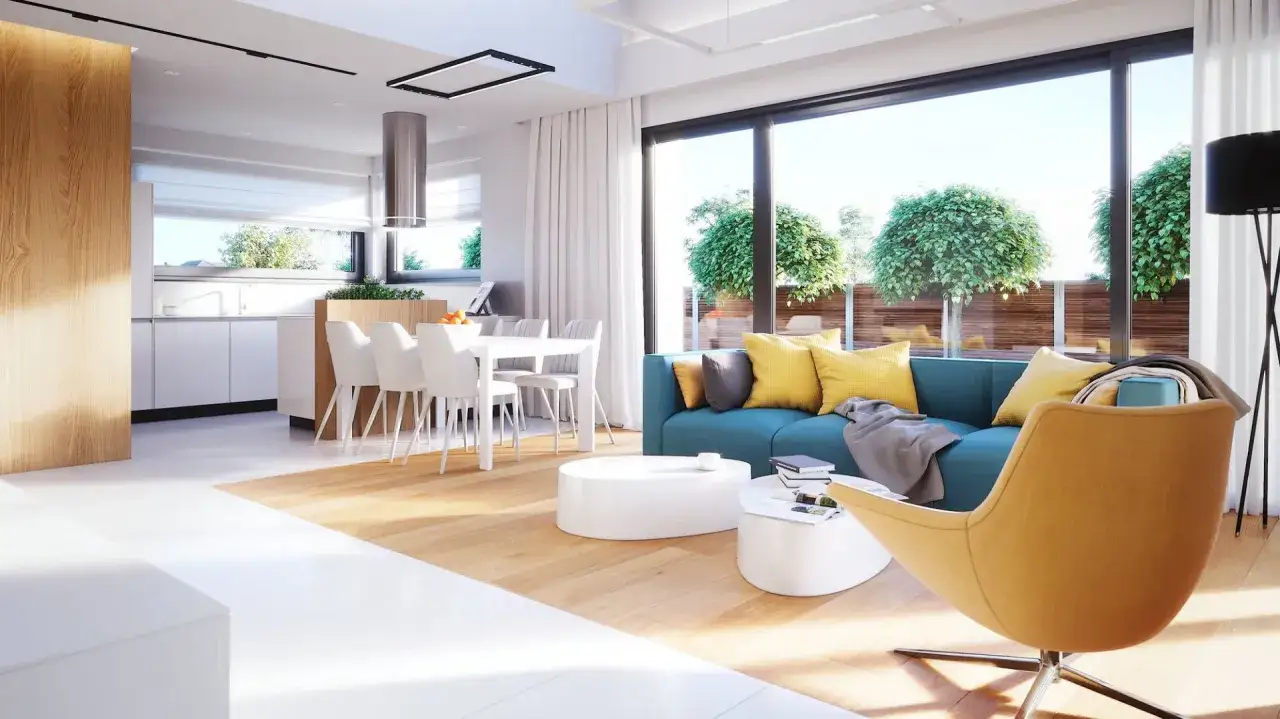 Nowoczesne, jasne wnętrze z widokiem na ogr&oacute;d. Wygodna kanapa i fotel zapraszają do relaksu. Idealne miejsce do życia w stylu piękne domy parterowe.