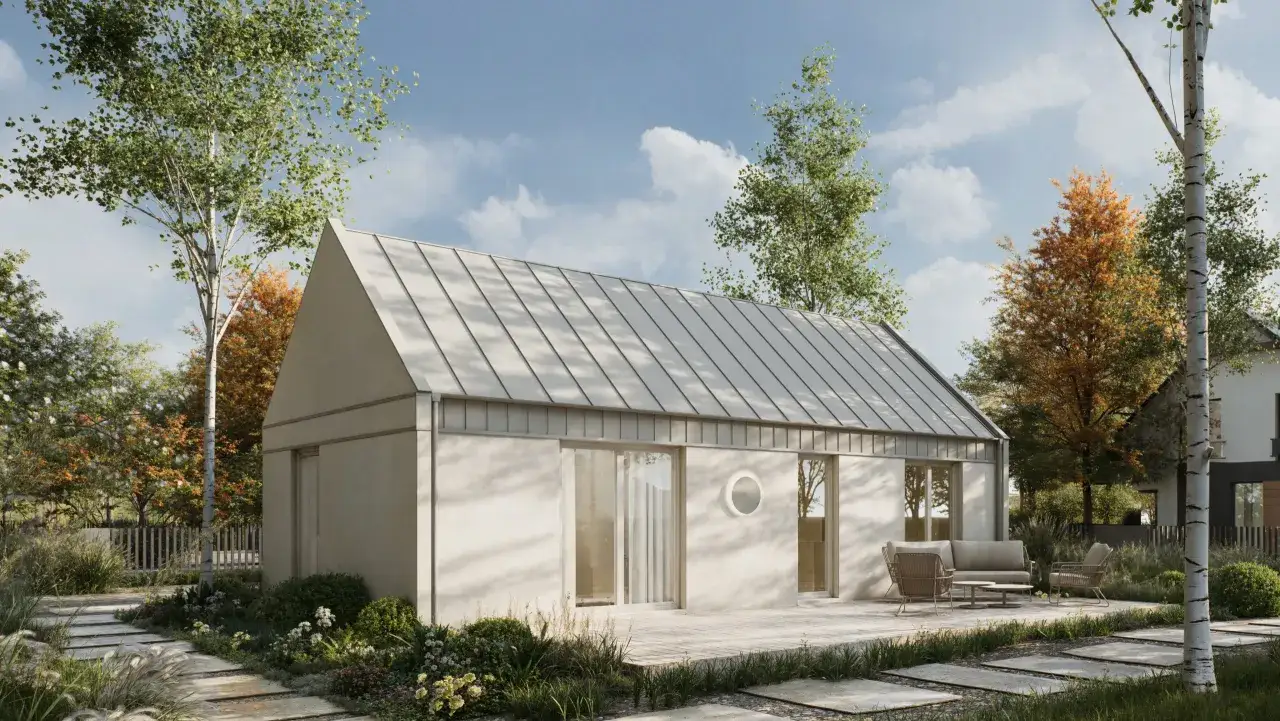 Nowoczesny dom z gotowych elementów, otoczony zielenią. Zastanawiasz się, ile kosztuje budowa domu z gotowych elementów?