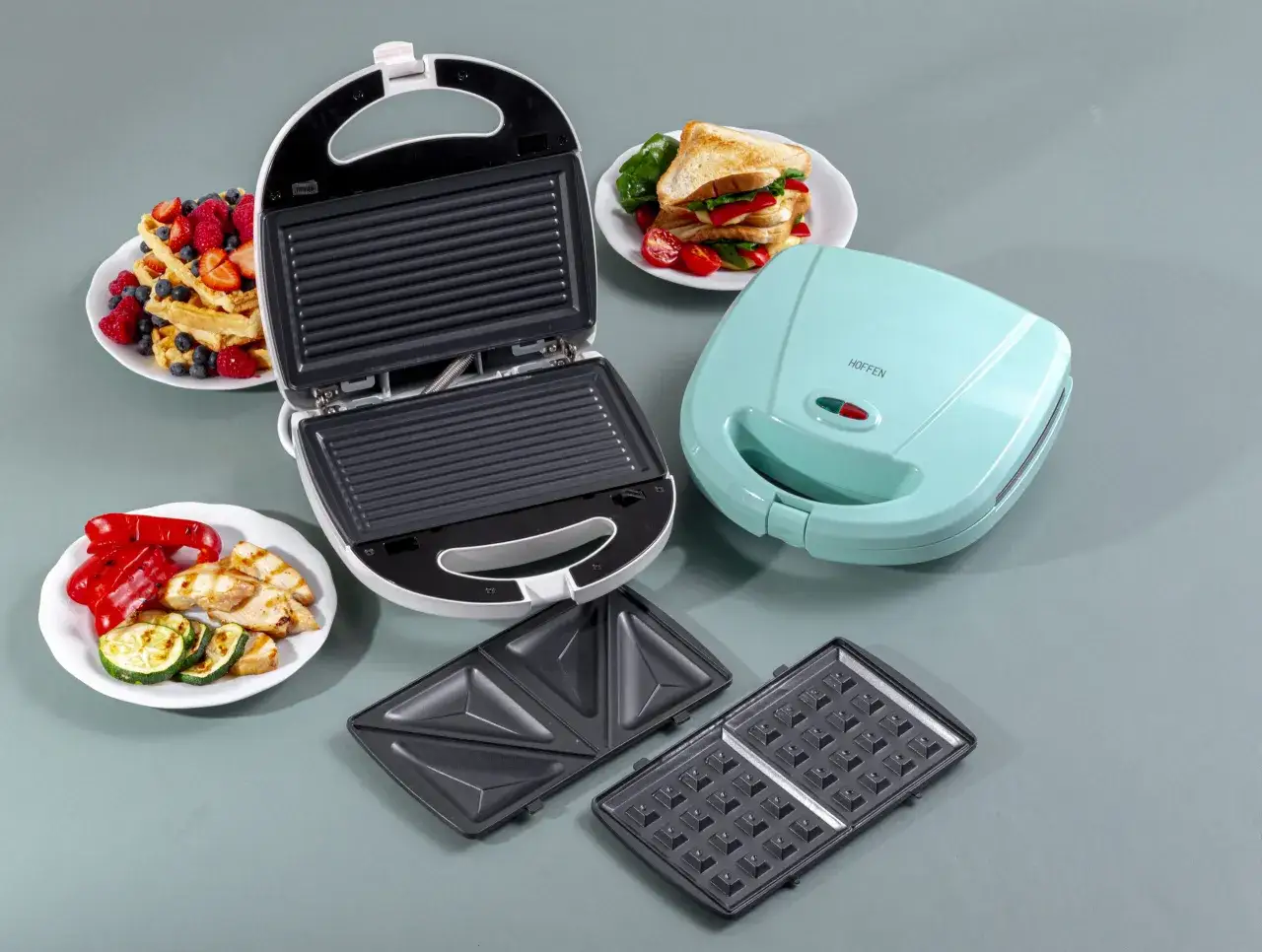 r&oacute;żne rodzaje opiekaczy do kanapek z wymiennymi płytkami