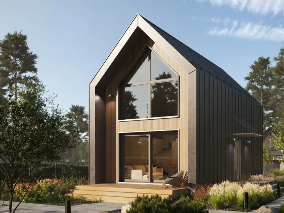 Nowoczesny dom mieszkalny z dużymi oknami, drewnianymi elementami i czarnym dachem. Czy dom mieszkalny jest budynkiem prawo budowlane?