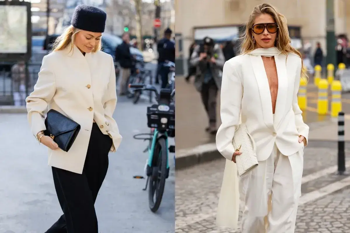 Dwie kobiety prezentują elegancki amerykański styl ubioru: jedna w kremowej marynarce i czarnych spodniach, druga w białym garniturze.