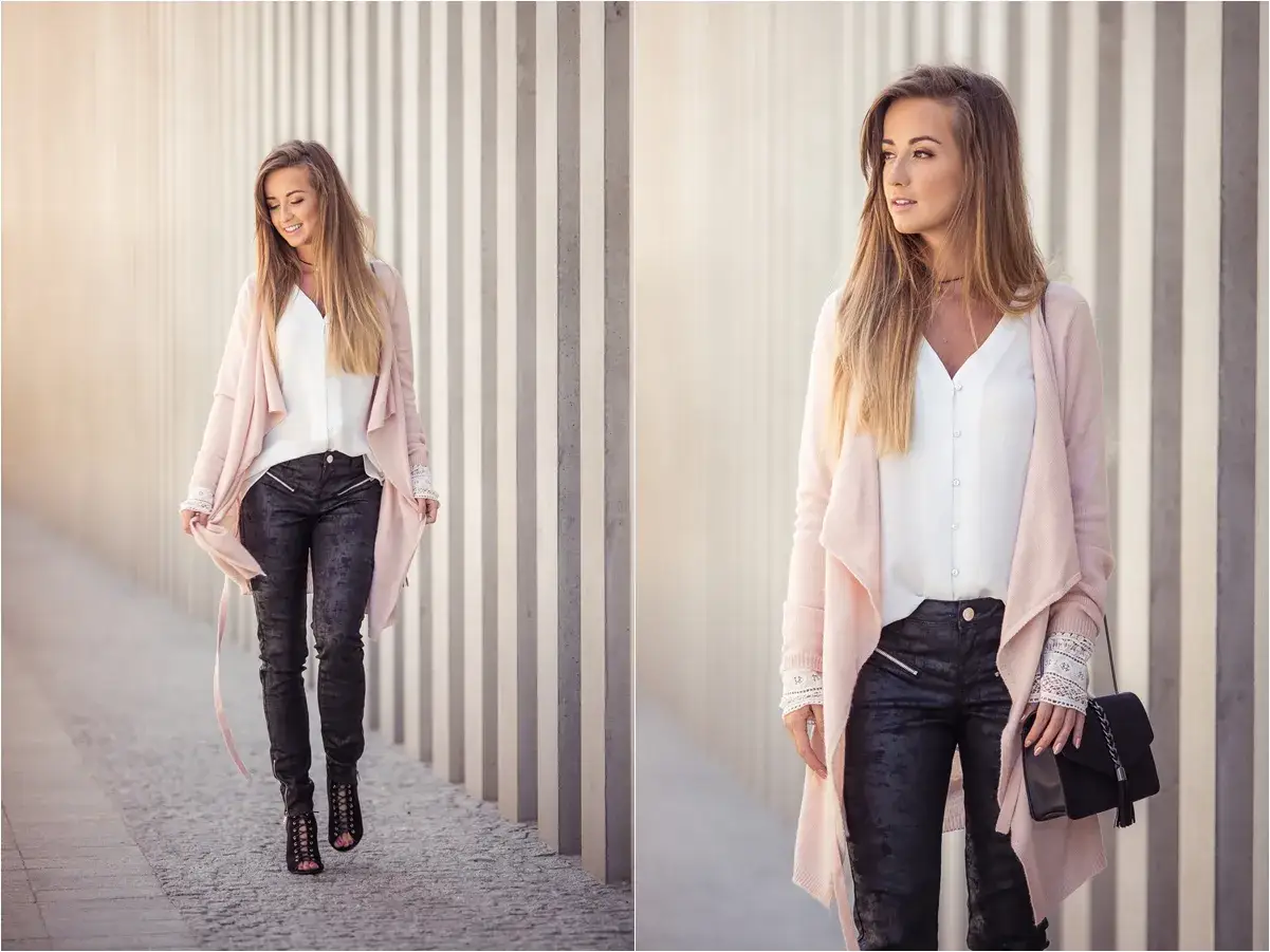 Elegancka kobieta w woskowanych spodniach i pudrowym kardiganie. Stylowe woskowane spodnie stylizacje na co dzień i wieczór.