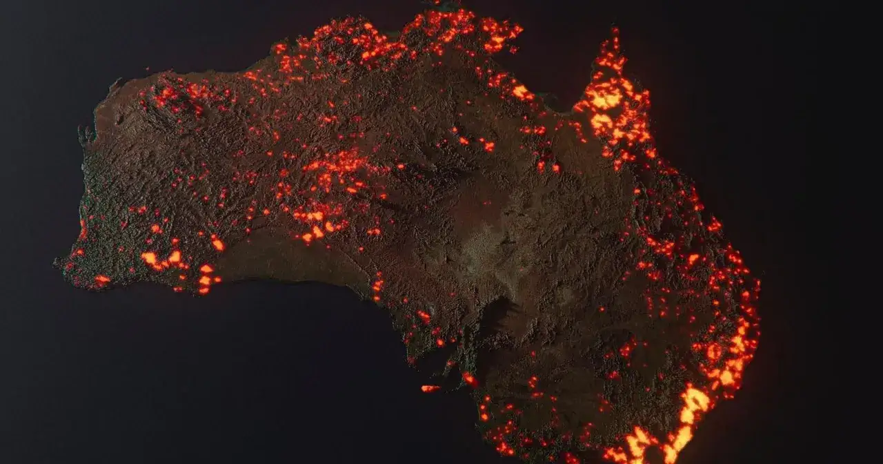Australia nocą, rozświetlona tysiącami ognisk. Obraz ukazuje skalę pożarów w Australii, ich przyczyny i skutki.