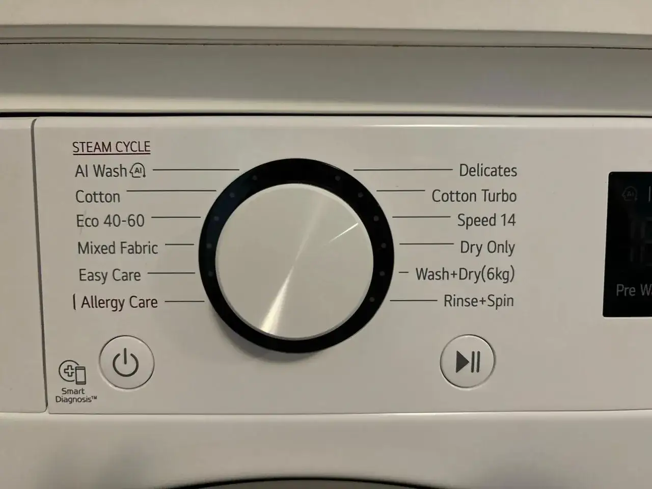 Panel pralki z programami: Al Wash, Cotton, Eco 40-60, Mixed Fabric, Easy Care, Allergy Care, Delicates, Cotton Turbo, Speed 14, Dry Only, Wash+Dry(6kg), Rinse+Spin. Pokazuje, jak prać wełnę w pralce.