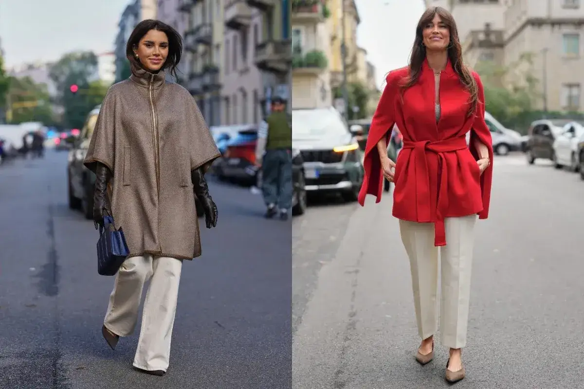 Dwie kobiety w eleganckich stylizacjach, obie w białych spodniach zimą. Jedna w brązowym ponczo i skórzanych rękawiczkach, druga w czerwonym płaszczu z peleryną.