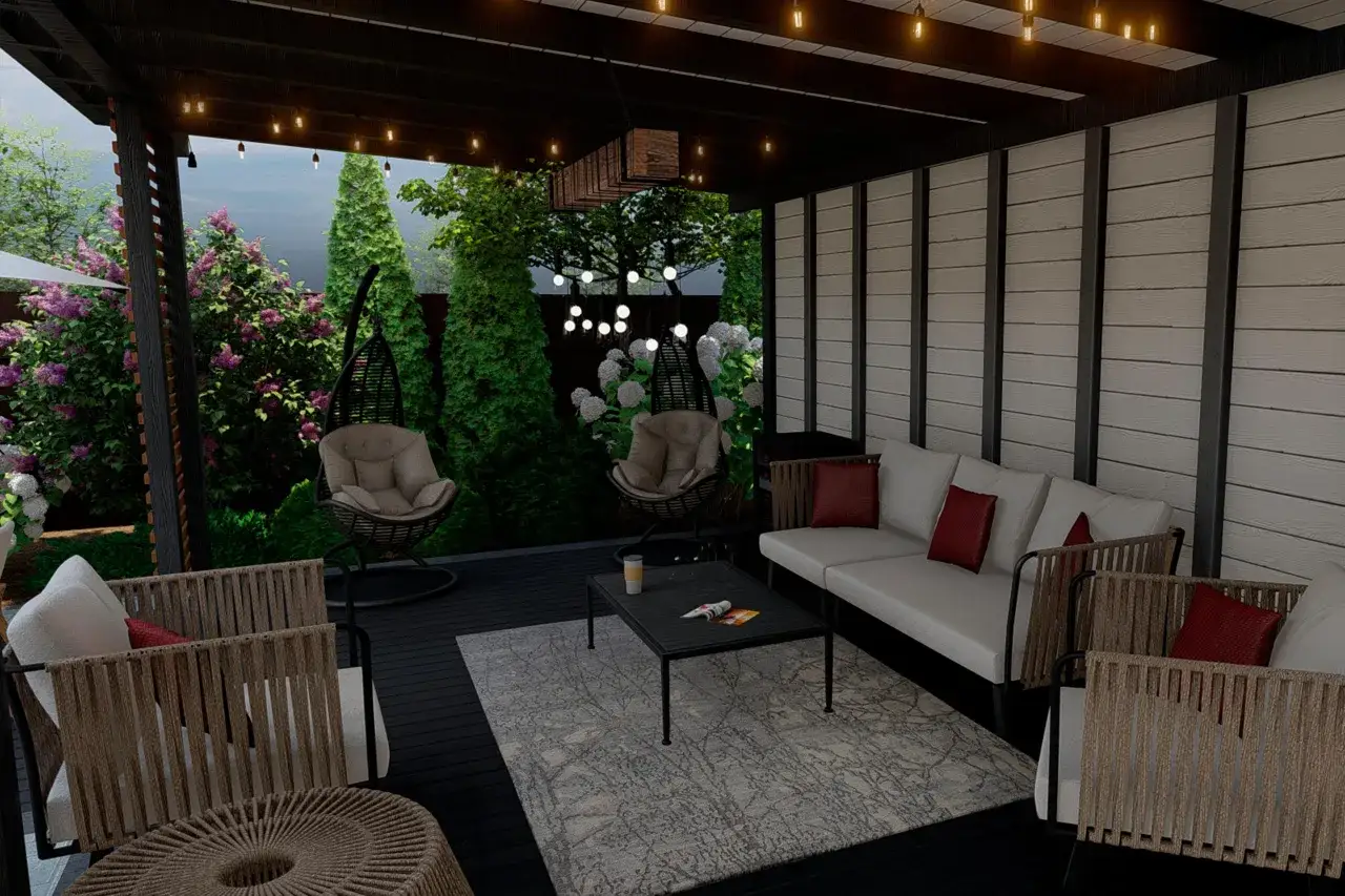 Nowoczesna weranda z wygodnymi fotelami, sofą i stolikiem kawowym, otoczona zielenią i kwitnącymi krzewami.