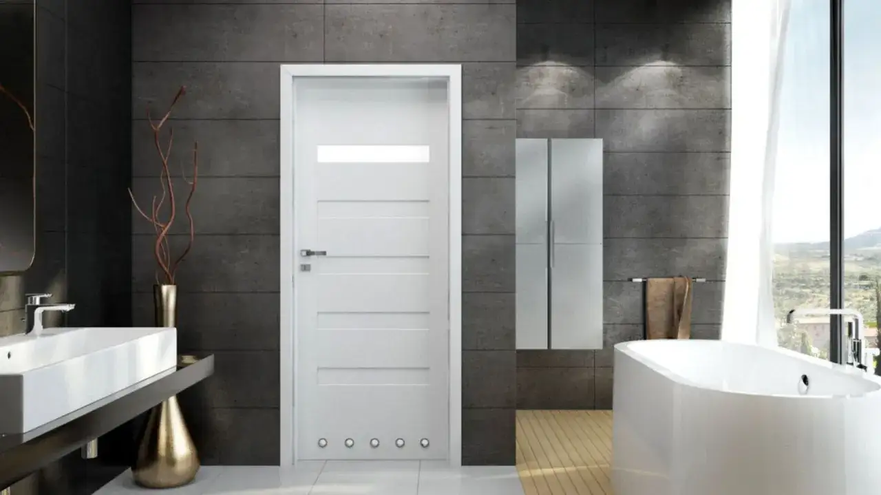 Nowoczesne drzwi aluminiowe wewnętrzne w łazience z wanną i umywalką.