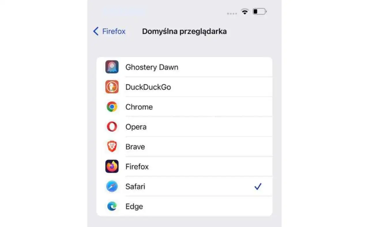 Ekran telefonu pokazuje, jak zmienić przeglądarkę w telefonie. Wybierz preferowaną przeglądarkę z listy: Ghostery, DuckDuckGo, Chrome, Opera, Brave, Firefox, Safari, Edge.