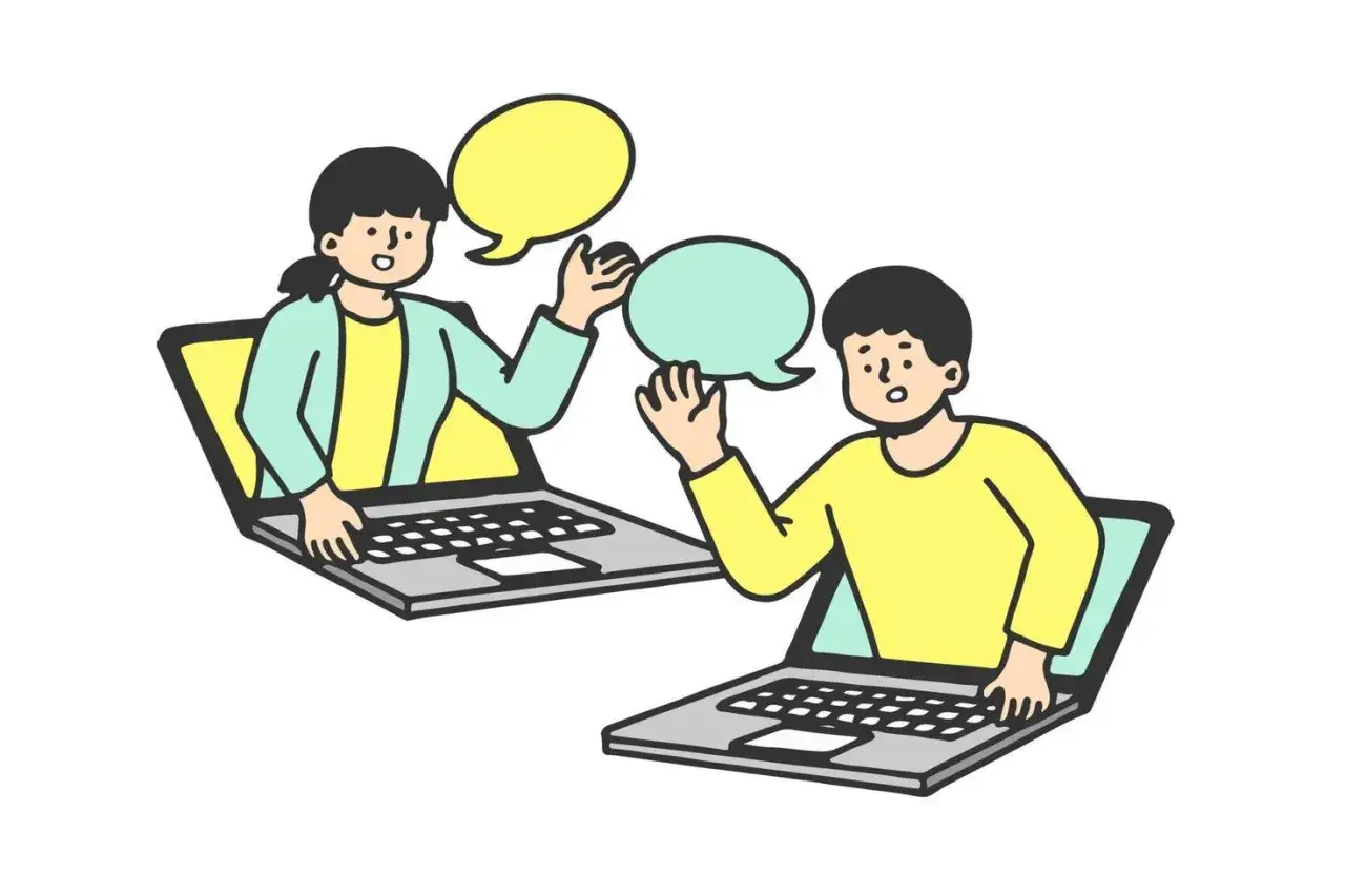 Dwie osoby wychodzą z laptop&oacute;w, rozmawiając przez internet. Dowiedz się, jak zacząć rozmowę przez internet.