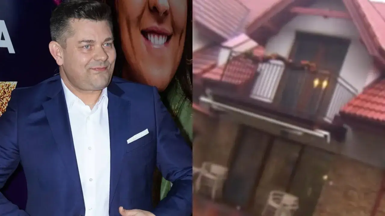 Zenek Martyniuk w garniturze obok domu, który może świadczyć o jego majątku.