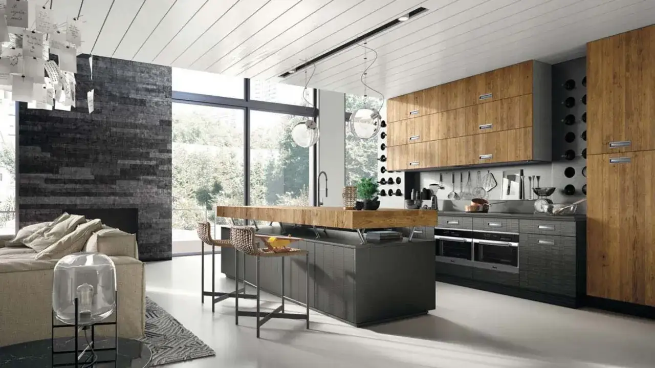 Nowoczesna kuchnia z wyspą i drewnianymi frontami. Betonowe akcenty dodają industrialnego charakteru. Beton w kuchni inspiracje.