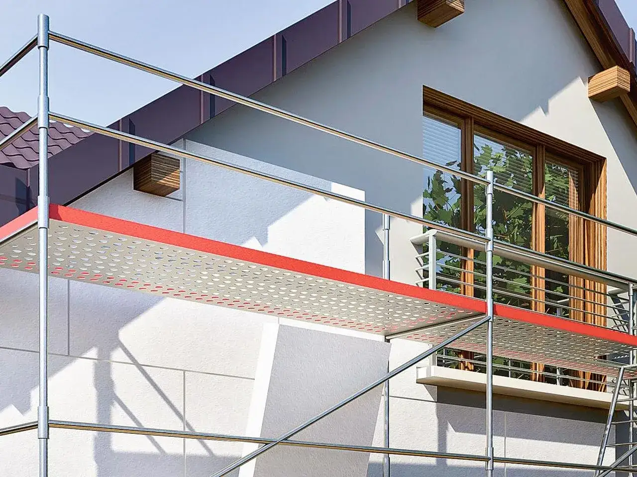 Rusztowanie przy domu, gdzie trwa ocieplanie ścian. Zastanawiasz się, ile kosztuje przyklejenie styropianu?