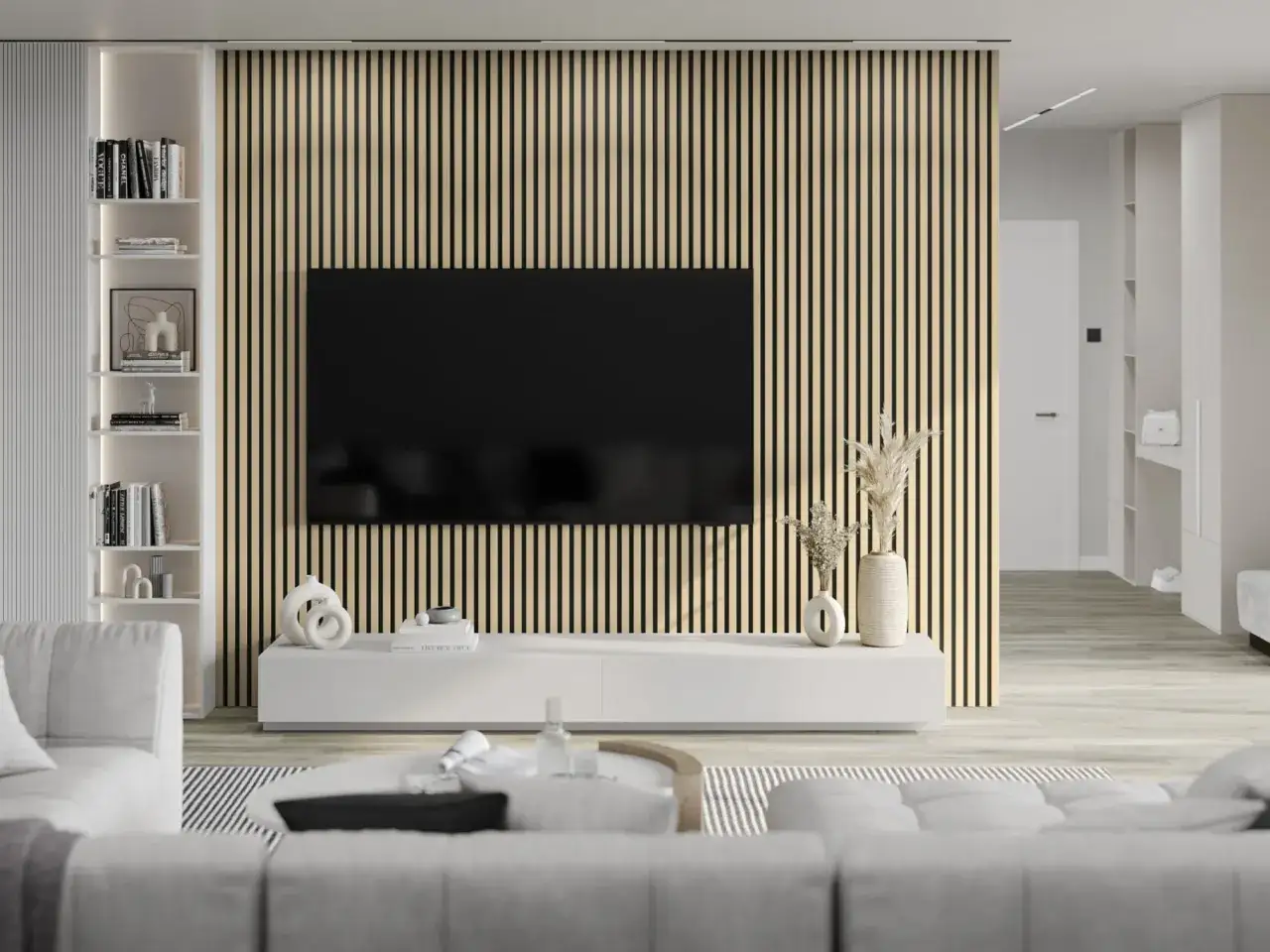 Nowoczesny salon z telewizorem na tle drewnianych lameli. Lamele to pionowe listwy, kt&oacute;re tworzą dekoracyjną ścianę.