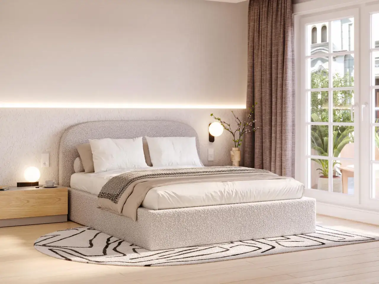 Przytulny styl sypialni z zaokrąglonym zagłówkiem, miękkim dywanem i oświetleniem tworzącym ciepłą atmosferę.