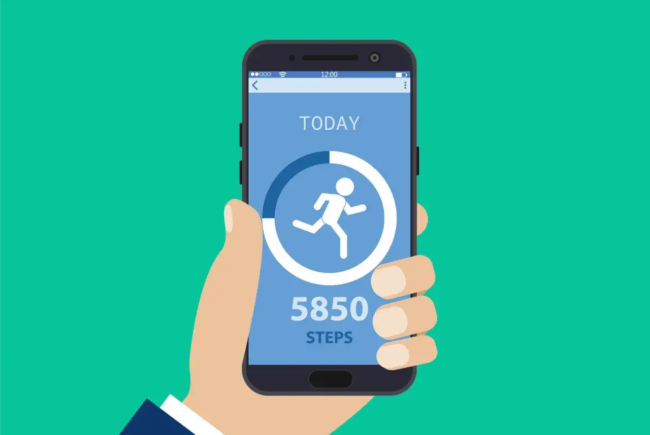 Dłoń trzyma smartfon z aplikacją krokomierz w telefonie. Wyświetla 5850 krok&oacute;w i ikonę biegnącej postaci.