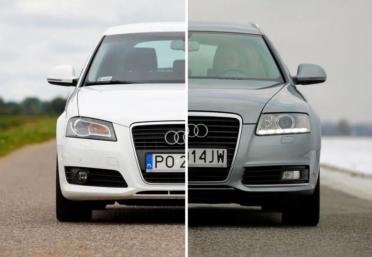 Białe Audi A3 i szare Audi A6 zderzają się na drodze, pomagając zdecydować, jakie audi wybrać.