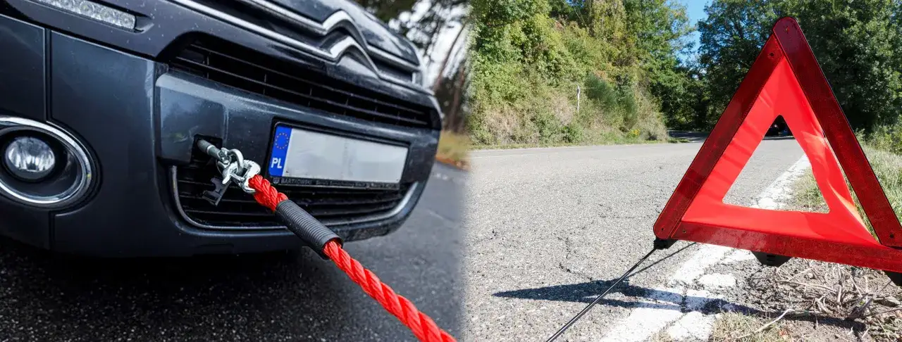 samoch&oacute;d holowany na lince holowniczej z znakiem ostrzegawczym
