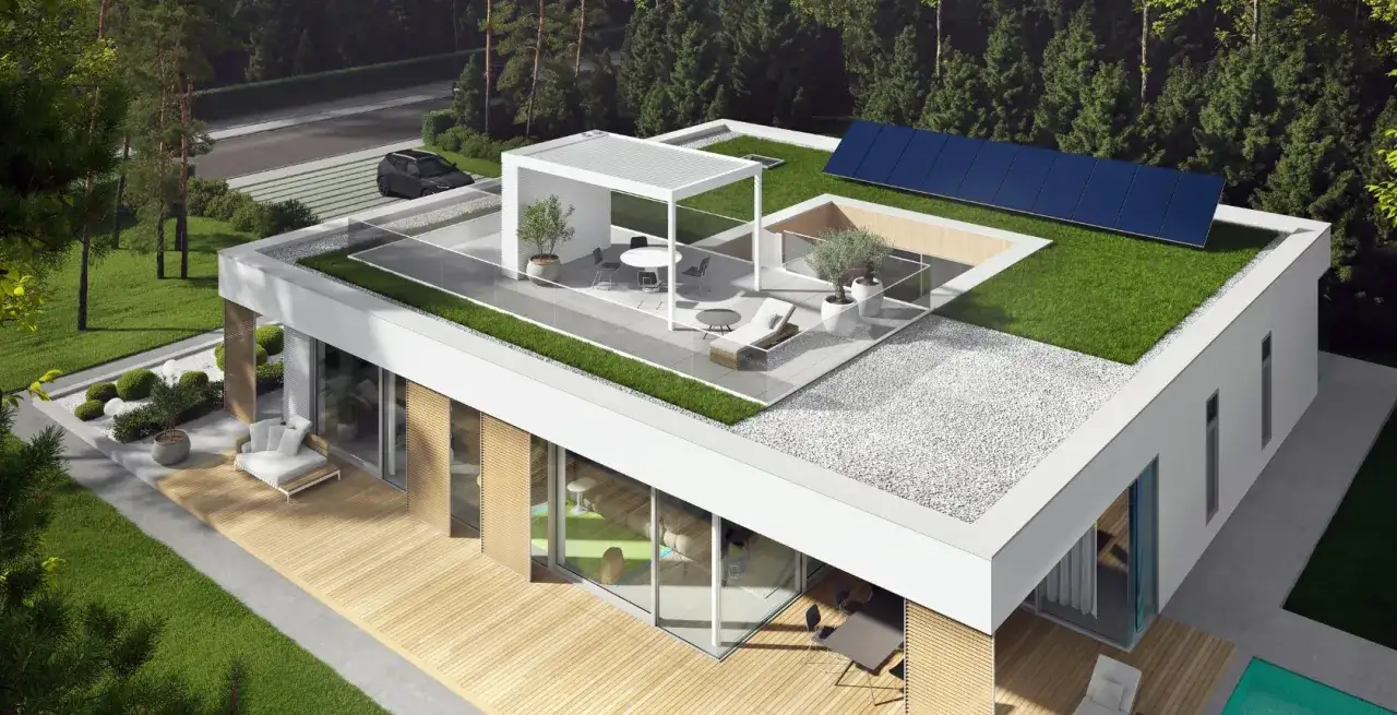 Nowoczesny dom z zielonym, lekki dach płaski, panele słoneczne i taras z pergolą.