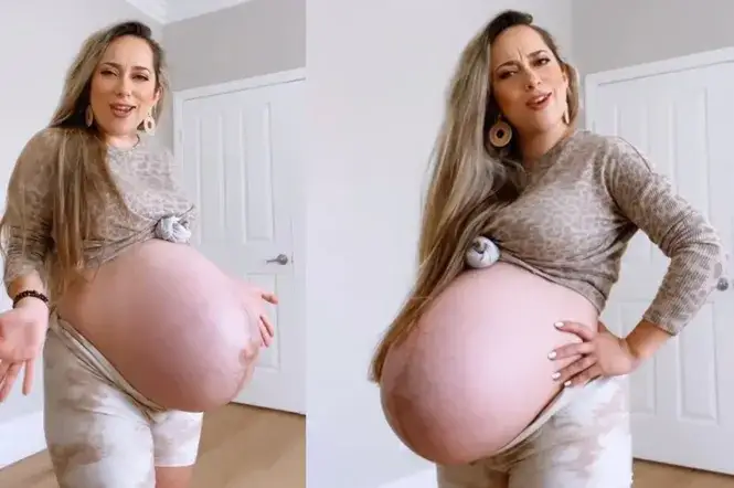 kobieta w ciąży bliźniaczej głaszcząca brzuch