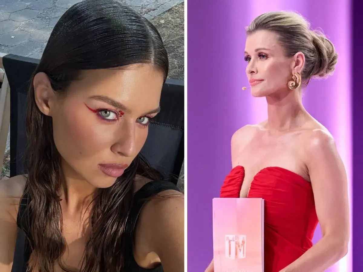 Dwie kobiety: jedna z wyrazistym makijażem oczu, druga w czerwonej sukni z nagrodą 