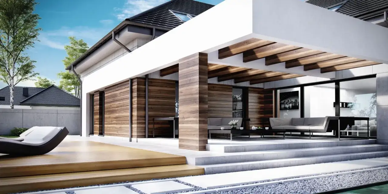 Nowoczesna elewacja budynku z drewnianymi panelami i dużymi przeszkleniami, tarasem i meblami wypoczynkowymi.