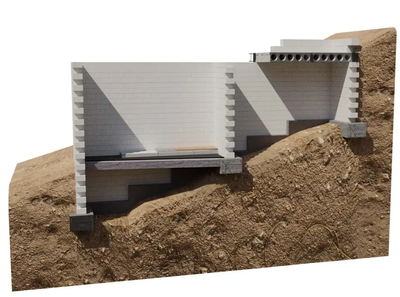 Schemat pokazuje, jak wybudować fundamenty na skarpie. Warstwy izolacji i bloczków tworzą stabilną konstrukcję.