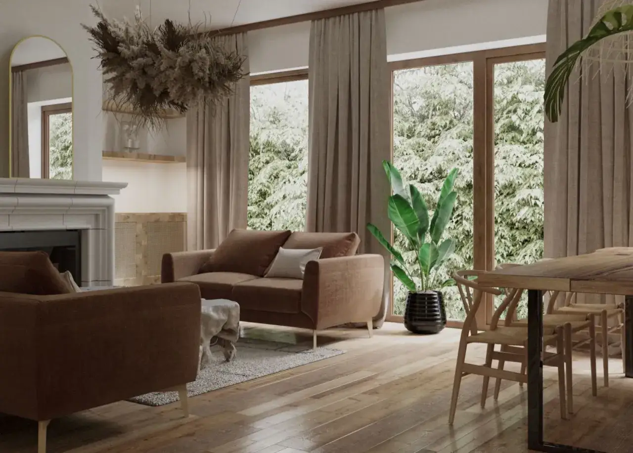 Przytulny salon w odcieniach beżu i brązu. Miękkie sofy, drewniane meble i bujna zieleń za oknem tworzą harmonijną całość.
