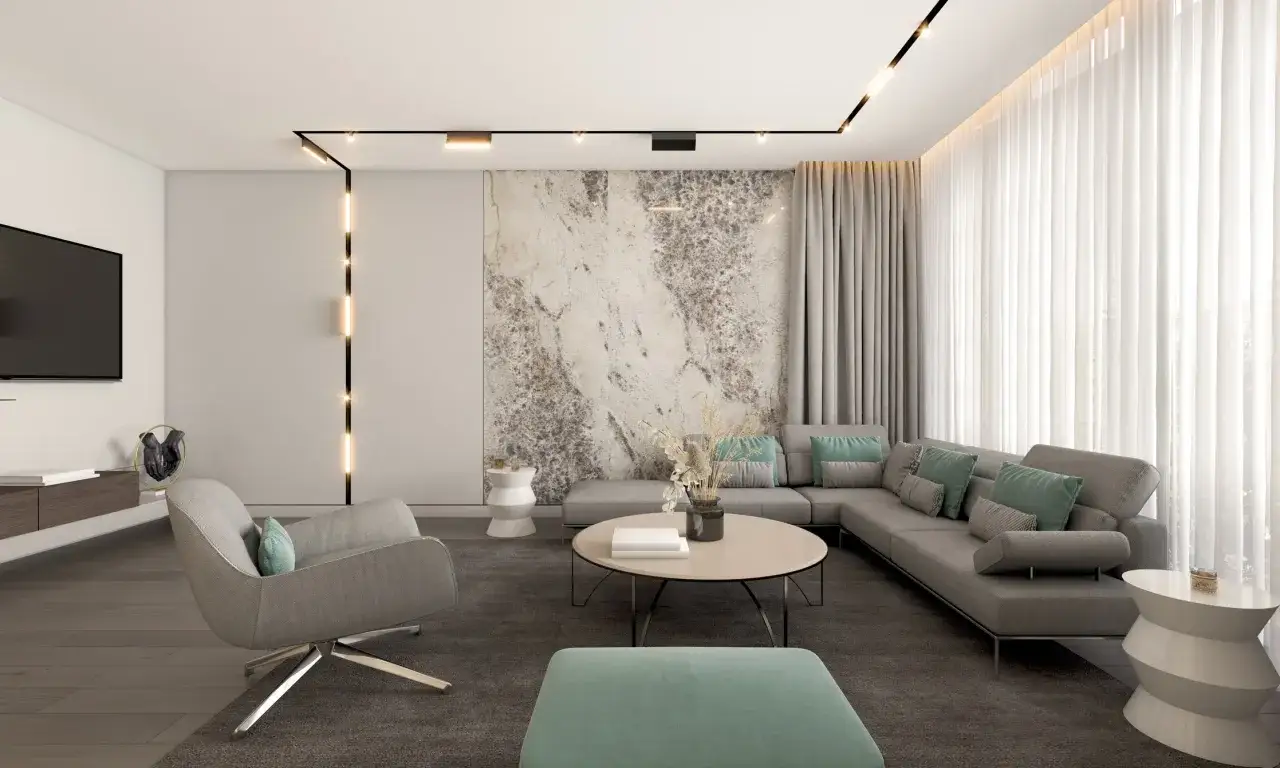 Nowoczesne oświetlenie szynowe wpuszczane w sufit podkreśla elegancję salonu z szarą sofą i designerskim fotelem.