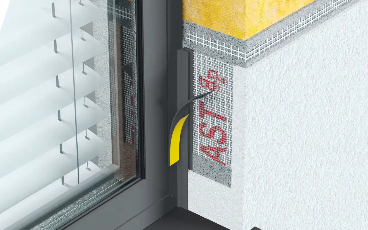 Detale montażu okna: widoczna listwa dylatacyjna do okien, siatka zbrojąca i izolacja.